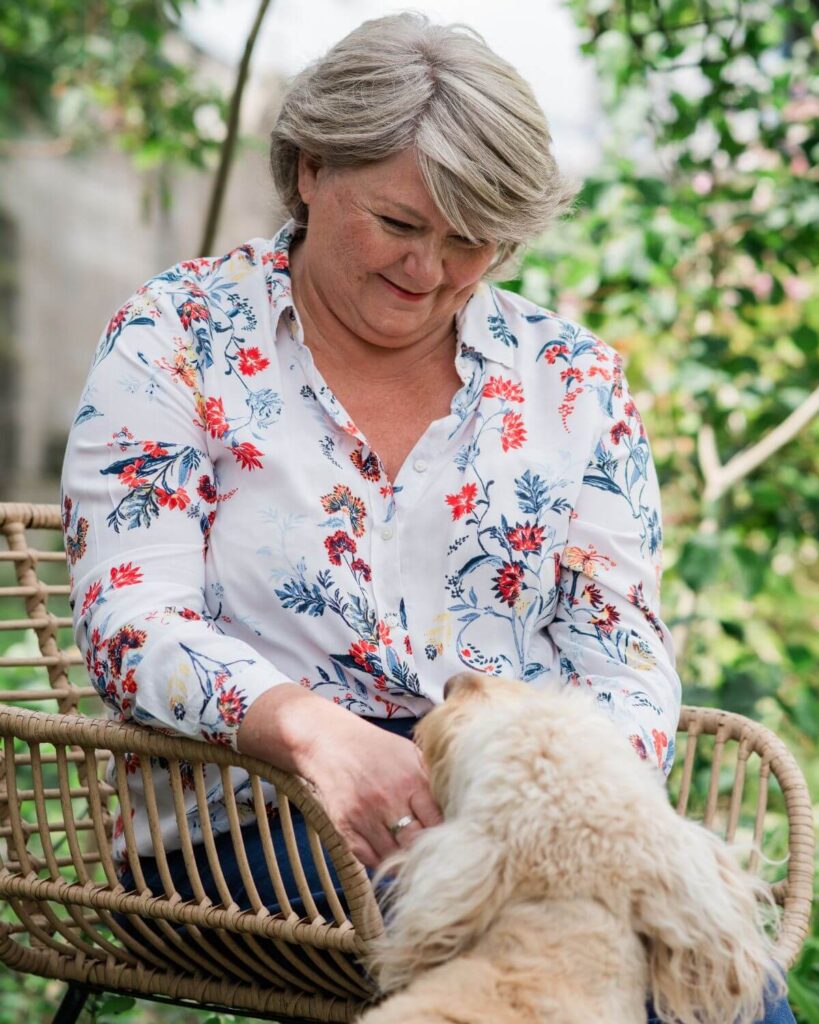 Lynne Jones with her dog, working as a therapeutic mentor and trainer