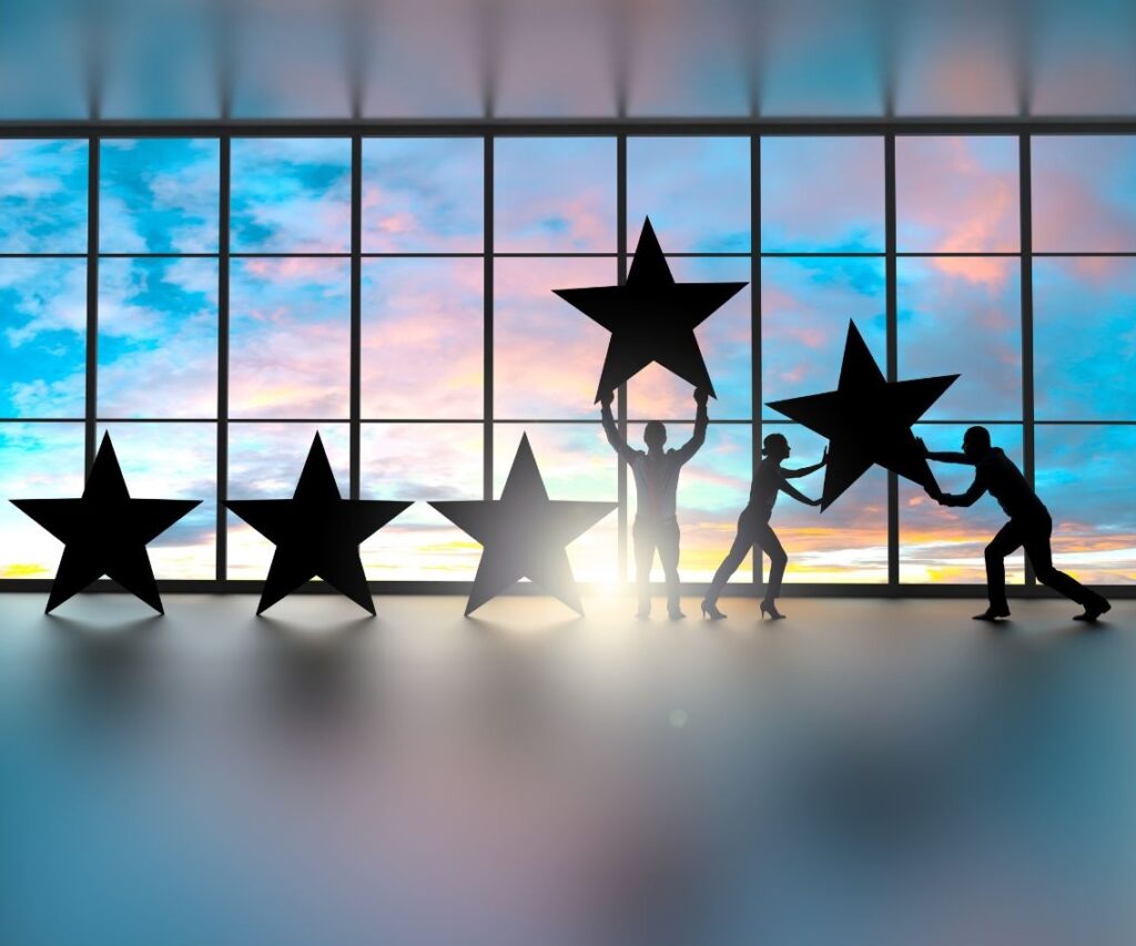 Illustration of men and women holding up large stars, representing teamwork, achievement, and workplace wellbeing