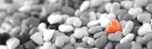 Pebbles with a red heart pebble