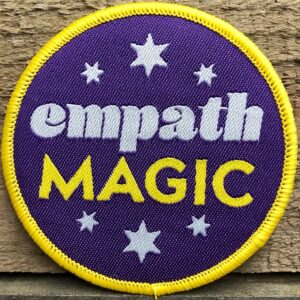 Badge with empath magic written
