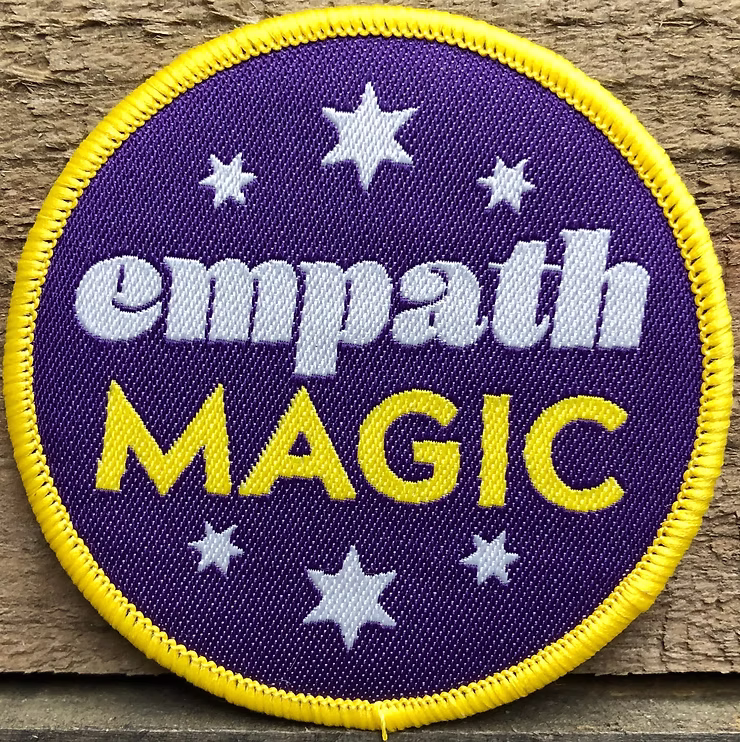 Badge with empath magic written